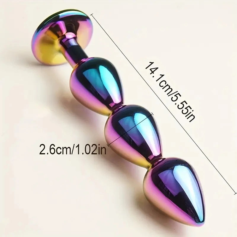 Masajeadores anales metálicos con joyas