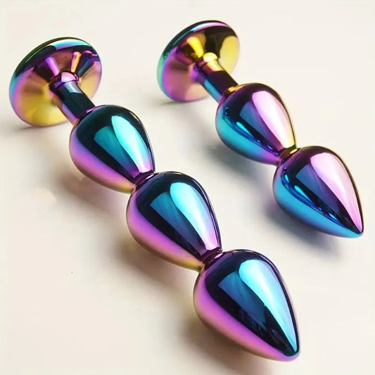 Masajeadores anales metálicos con joyas